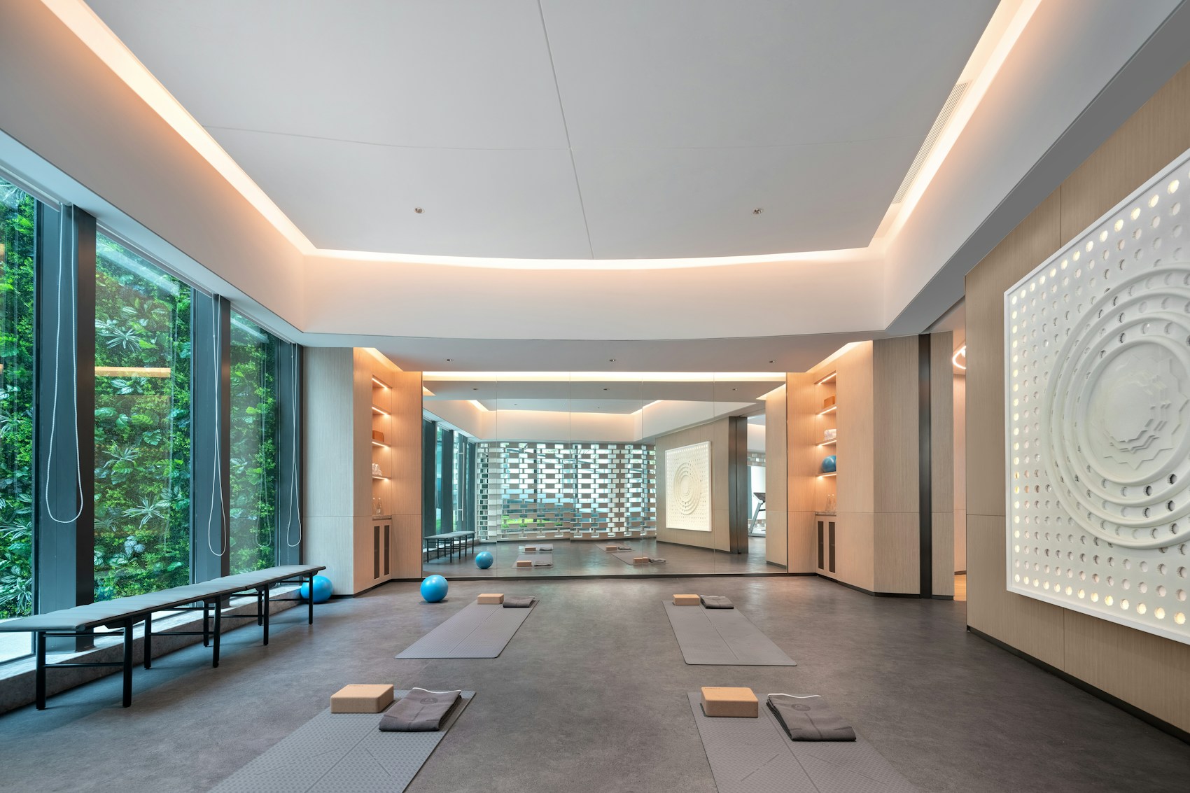 Light-filled movement studio with mats and large windows